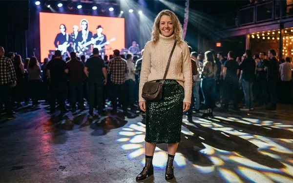 A woman in a chic outfit for a winter concert